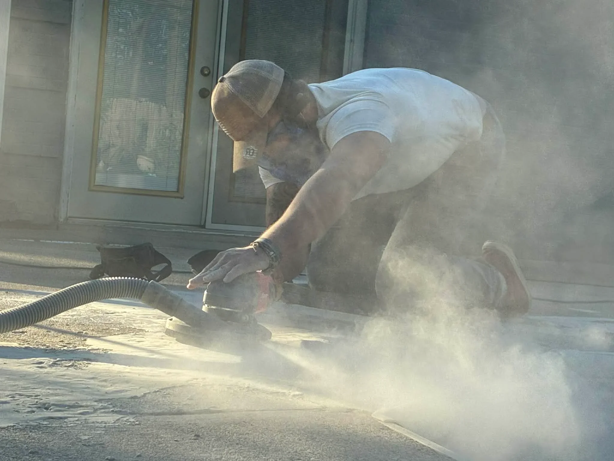 Concrete grinding and dust control during epoxy flooring surface preparation