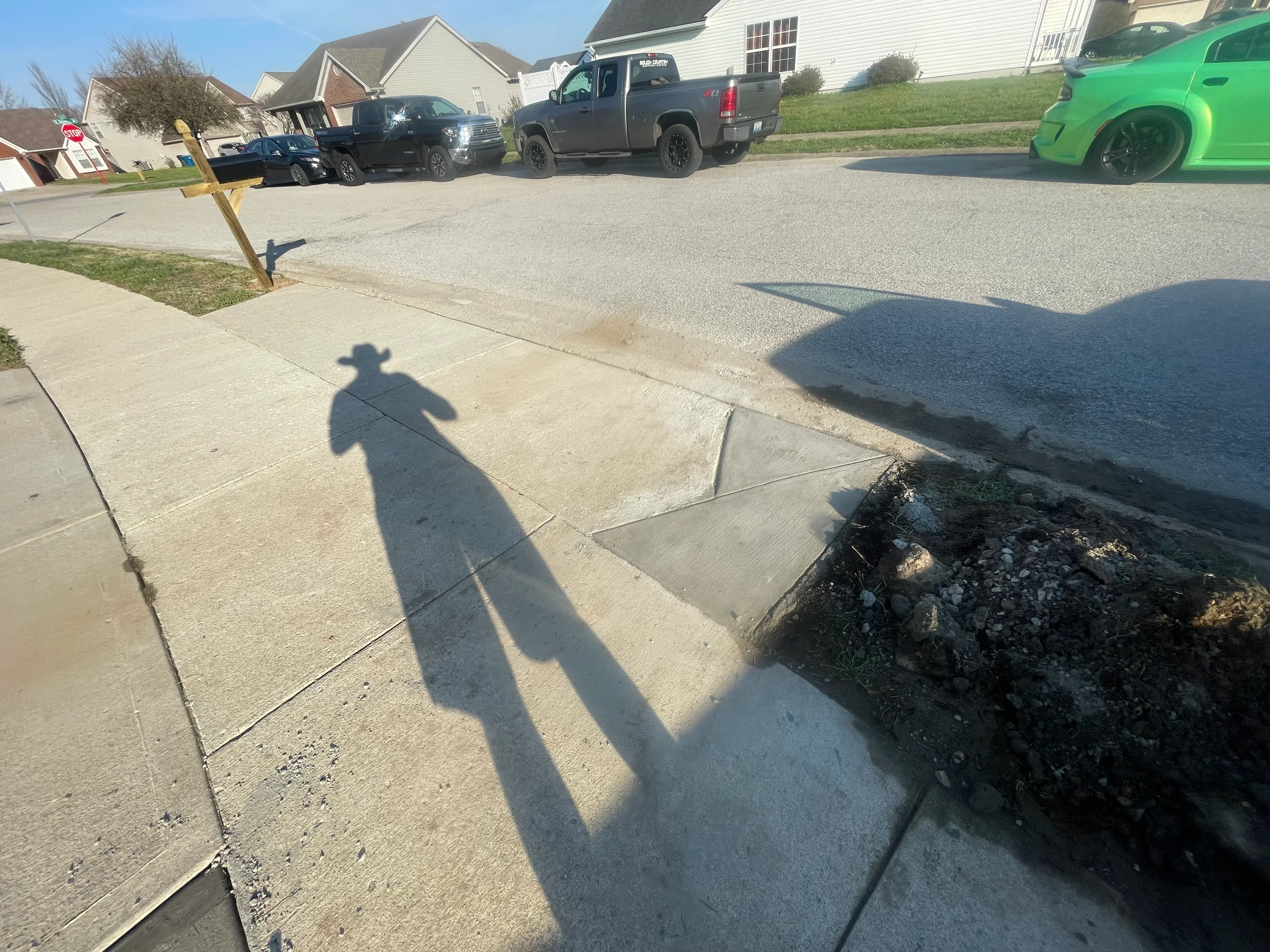 Newly coated epoxy driveway with clean finish and visible concrete edge detail